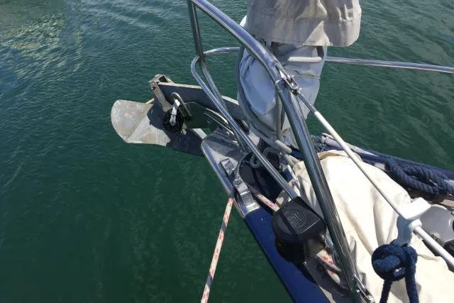 Slide: The Image of Bow of a 1997 Gorbon Custom 66 yacht with anchor and railing. - 221