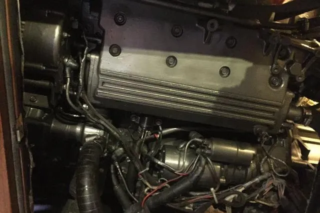 Slide: The Image of Engine compartment of a 1997 Gorbon Custom 66, showcasing intricate mechanical components and wiring. - 226