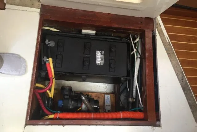 Slide: The Image of Battery compartment of a 1997 Gorbon Custom 66 boat, featuring wiring and components. - 230