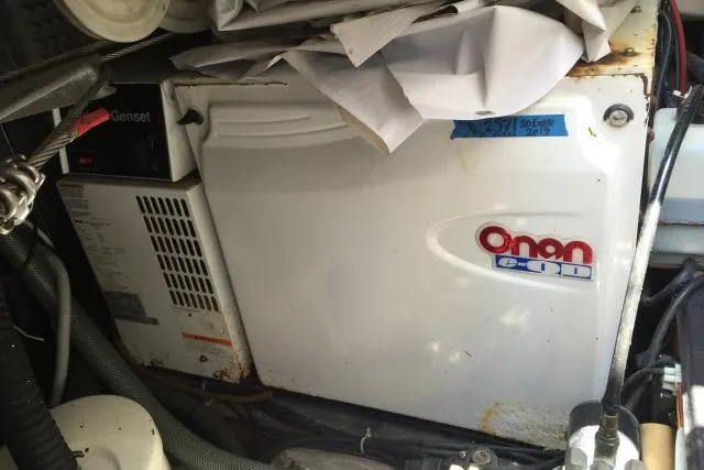 Slide: The Image of Onan generator inside a 1997 Gorbon Custom 66 boat engine room. - 231
