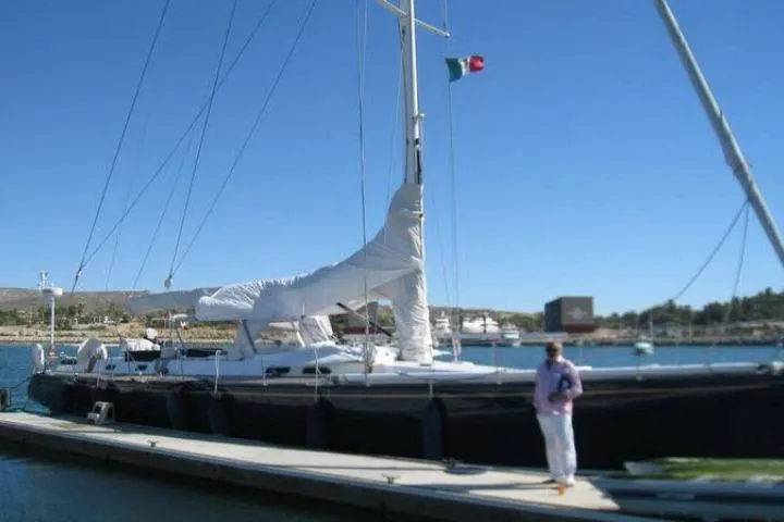 Slide: The Image of Sailboat docked at marina, Gorbon Custom 66, 1997 model, with clear blue sky. - 243