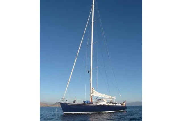 Slide: The Image of Sailing yacht Gorbon Custom 66, 1997 model, on calm blue waters under clear sky. - 244