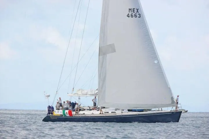 Slide: The Image of Sailing yacht Gorbon Custom 66, 1997, with crew on deck, sails in open water. - 249