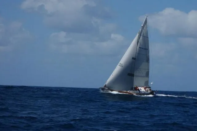 Slide: The Image of Sailing yacht Gorbon Custom 66 (1997) navigating open sea under clear skies. - 250