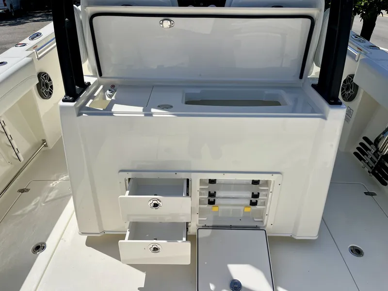 Slide: The Image of 2026 Cobia 320 Center Console with storage and drawers. - 12