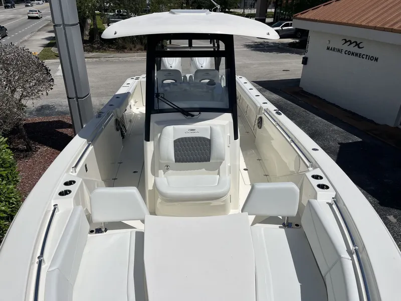 Slide: The Image of 2026 Cobia 320 Center Console boat on display. - 18