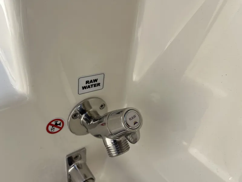 Slide: The Image of Raw water faucet on Cobia 320 Center Console 2026 boat. - 32