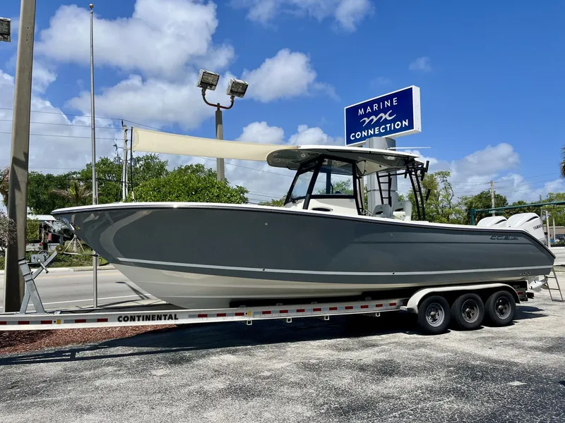 Slide: The Image of 2026 Cobia 320 Center Console on trailer at Marine Connection. - 36