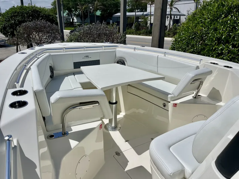 Slide: The Image of Interior of 2026 Cobia 320 Center Console with seating and table. - 19