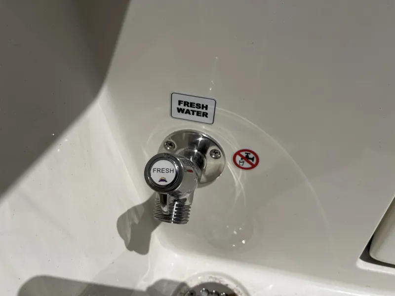 Slide: The Image of Fresh water tap on Cobia 320 Center Console 2026. - 31