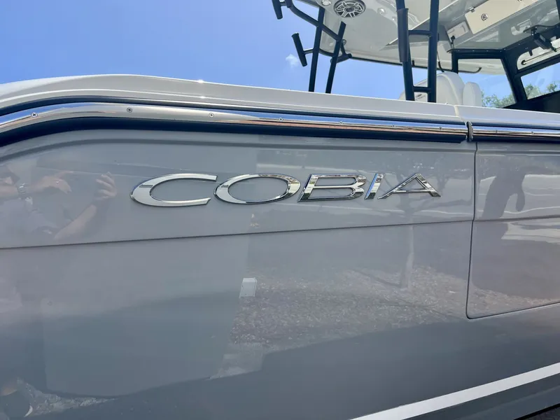 Slide: The Image of Cobia 320 Center Console boat, 2026 model, side view. - 7