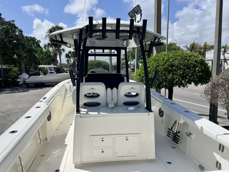Slide: The Image of 2026 Cobia 320 Center Console boat with spacious deck and seating area. - 11