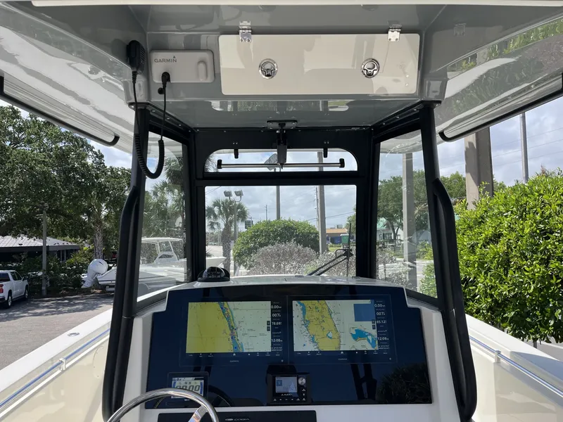 Slide: The Image of Interior view of 2026 Cobia 320 Center Console boat with navigation system. - 14