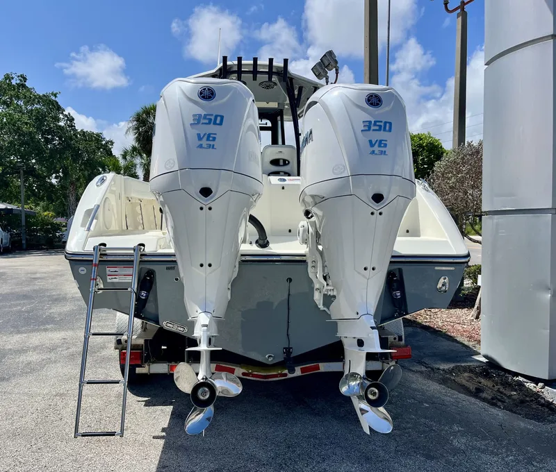 Slide: The Image of 2026 Cobia 320 Center Console with twin 350 HP outboard engines. - 5