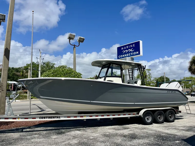 The Image of 2026 Cobia 320 Center Console on trailer at Marine Connection. - 1
