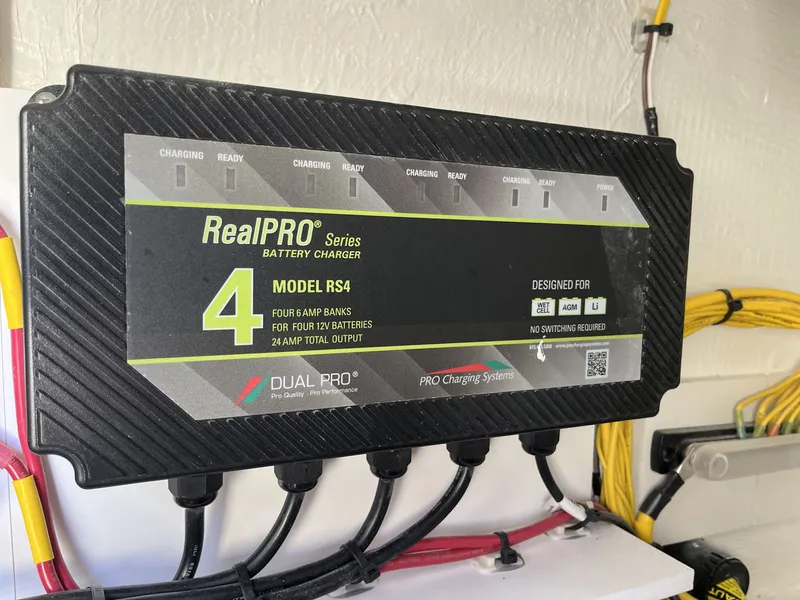 Slide: The Image of RealPRO RS4 battery charger in 2026 Cobia 320 Center Console. - 34
