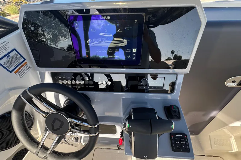 Slide: The Image of Modern Navan S30 2026 boat dashboard with touchscreen controls and steering wheel. - 13