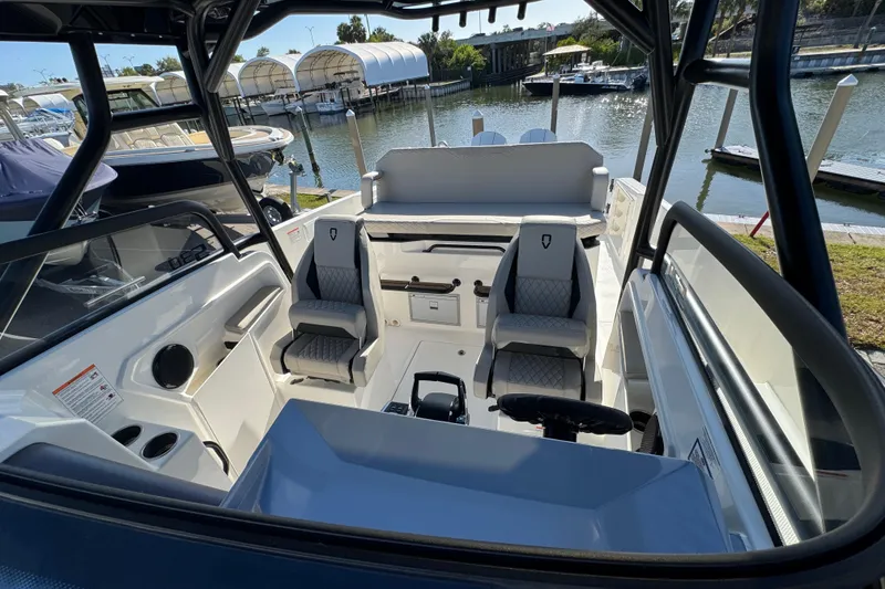 Slide: The Image of Interior view of 2026 Navan S30 boat with modern seating and steering wheel. - 15