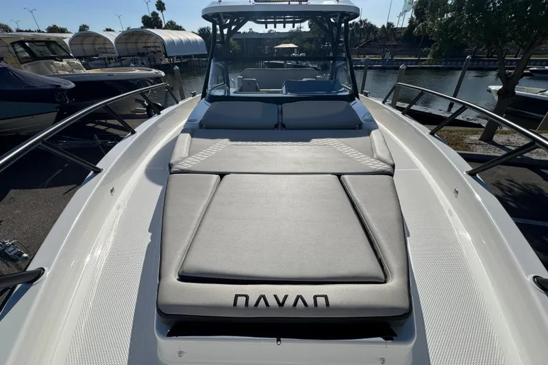 Slide: The Image of 2026 Navan S30 boat with cushioned deck, docked at marina. - 17