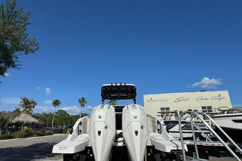 Slide: The Image of Navan S30 2026 boat with dual engines, parked under clear blue sky. - 2