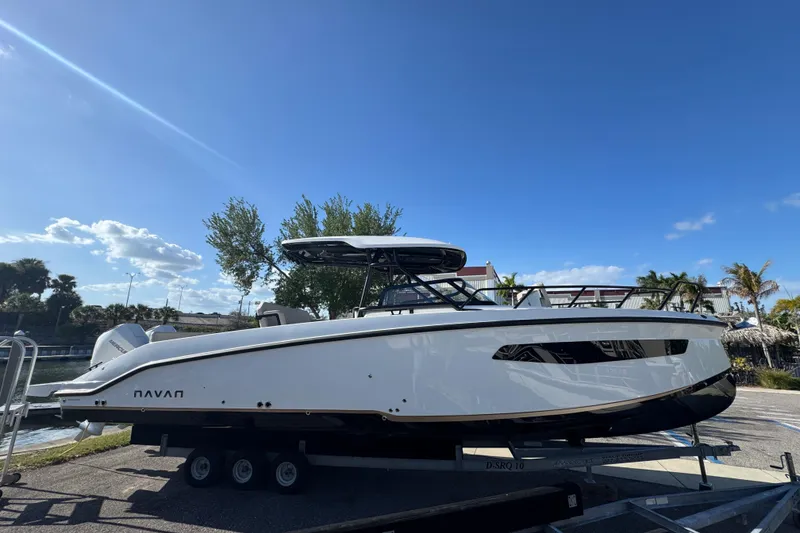 Slide: The Image of Navan S30 2026 boat on trailer under clear blue sky. - 3