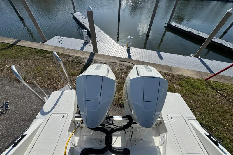 Slide: The Image of 2026 Navan S30 boat with dual engines docked at a marina. - 4
