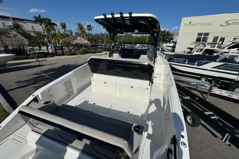 Slide: The Image of Modern Navan S30 boat, 2026 model, docked with spacious deck and seating area. - 6