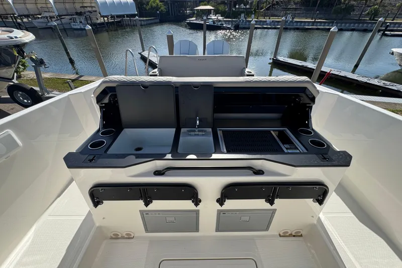 Slide: The Image of Outdoor kitchen on 2026 Navan S30 boat with sink, grill, and storage compartments. - 8