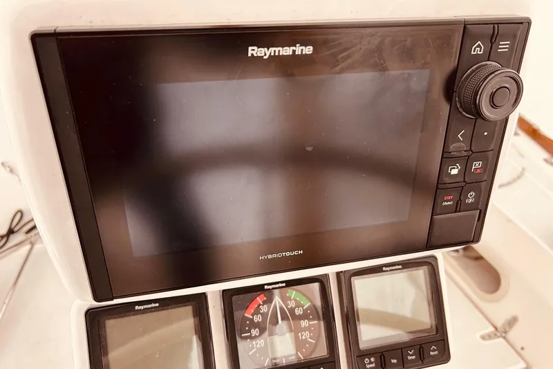 Slide: The Image of Raymarine navigation system on 2004 Sabre 426 yacht, featuring multifunction display and controls. - 17