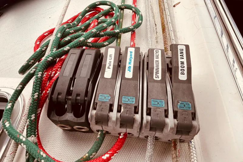 Slide: The Image of Sailing ropes and labeled clutches on a 2004 Sabre 426 yacht deck. - 18