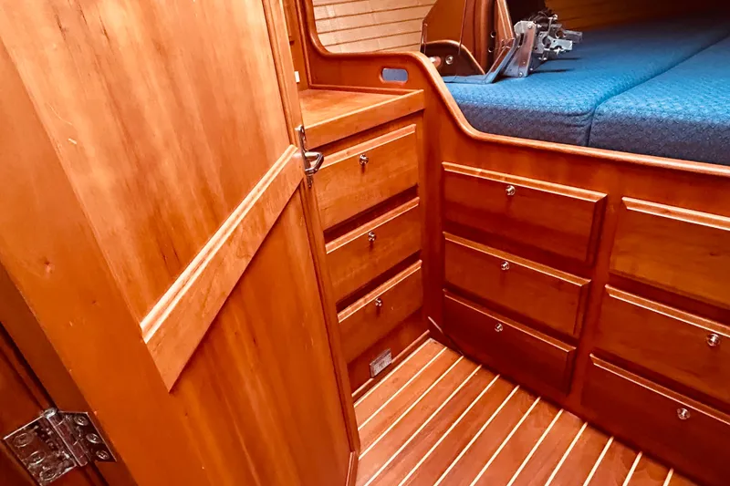 Slide: The Image of Wooden interior of 2004 Sabre 426 yacht with drawers and bed. - 34