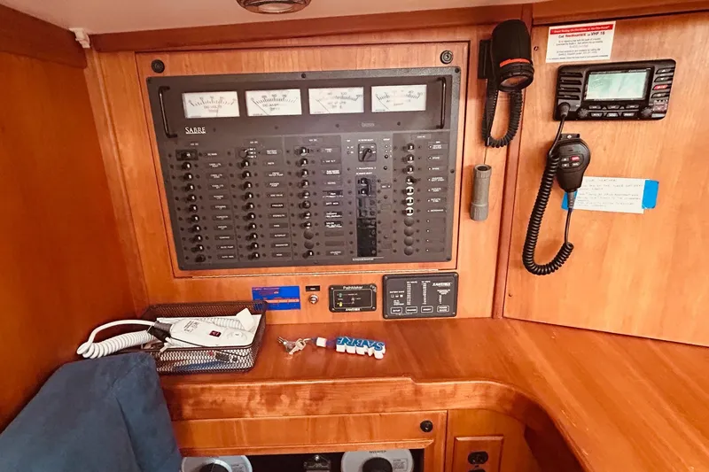 Slide: The Image of Electrical control panel in a 2004 Sabre 426 yacht interior. - 45