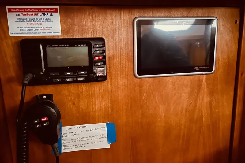 Slide: The Image of VHF radio and display panel on 2004 Sabre 426 boat interior. - 47