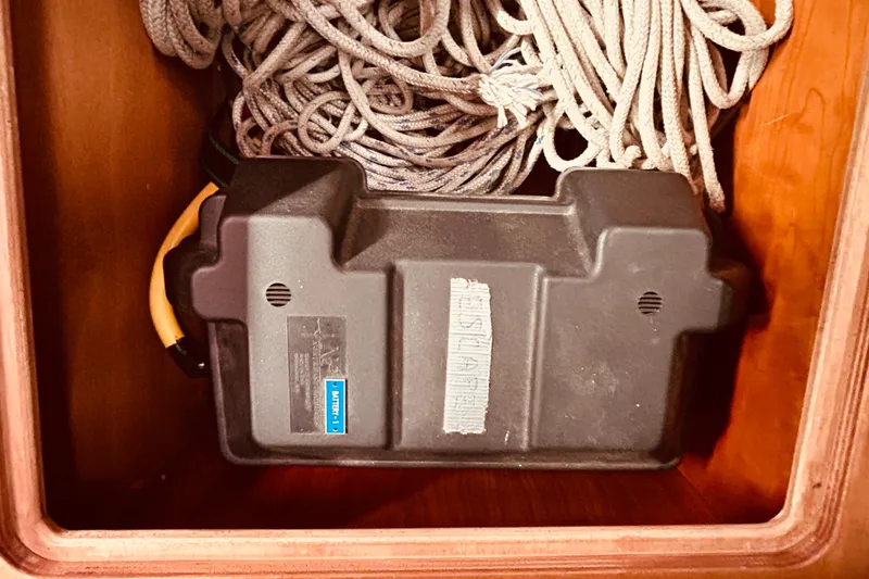 Slide: The Image of Storage compartment with coiled rope and black plastic box, Sabre 426, 2004 model. - 50