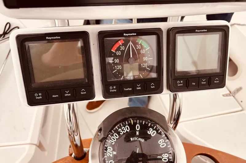 Slide: The Image of Boat dashboard with Raymarine displays and Ritchie compass, Sabre 426, 2004 model. - 9