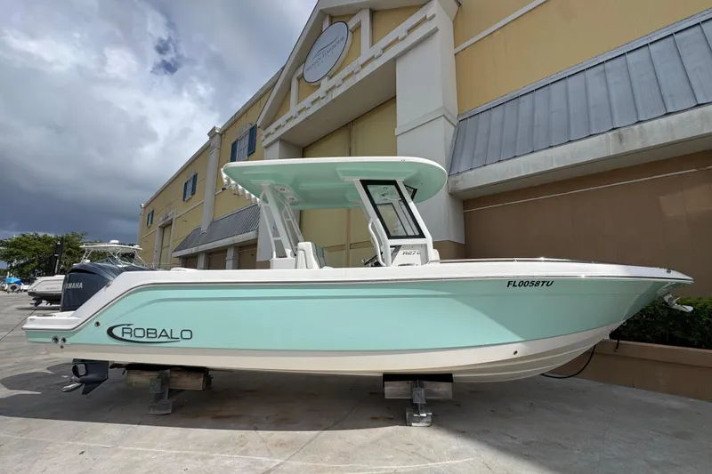 The Image of 2023 Robalo R272 Center Console boat displayed outdoors, featuring sleek design and modern features. - 0