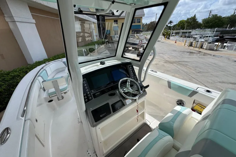 Slide: The Image of 2023 Robalo R272 Center Console boat interior with modern helm and seating. - 8