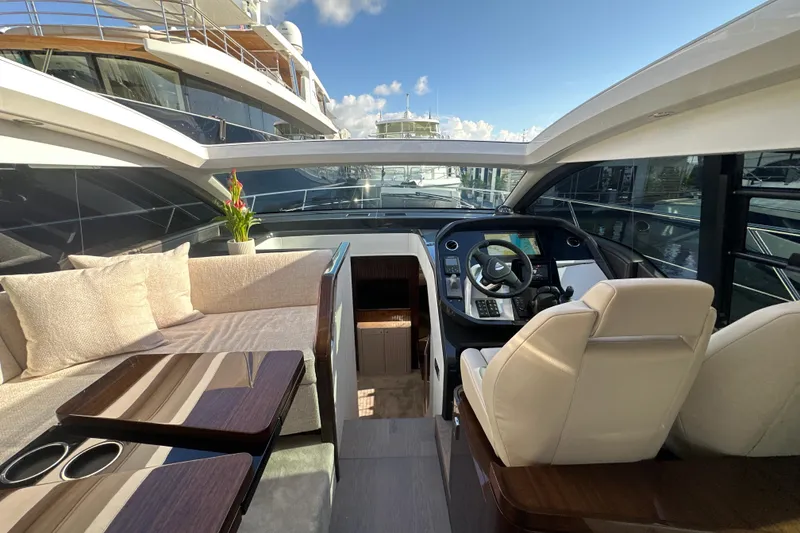 Slide: The Image of Interior view of 2026 Fairline Targa 47 GT yacht with luxurious seating and helm. - 20