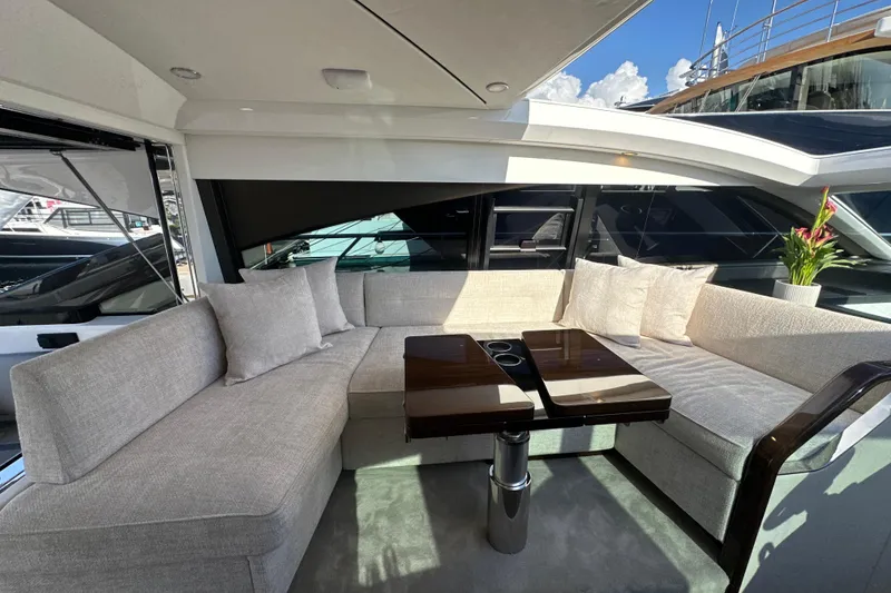 Slide: The Image of Luxurious seating area on 2026 Fairline Targa 47 GT yacht with elegant table and cushions. - 21