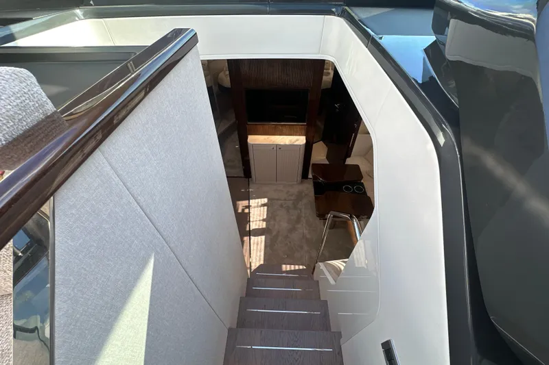 Slide: The Image of Interior staircase of 2026 Fairline Targa 47 GT yacht, featuring modern design and luxury finishes. - 24