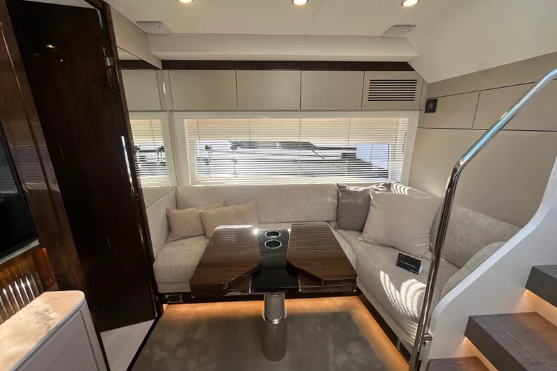 Slide: The Image of Luxurious interior of 2026 Fairline Targa 47 GT yacht with modern seating and table. - 26