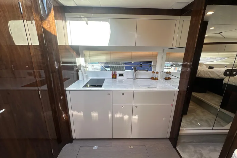 Slide: The Image of Luxurious interior of 2026 Fairline Targa 47 GT yacht with modern kitchen design. - 28