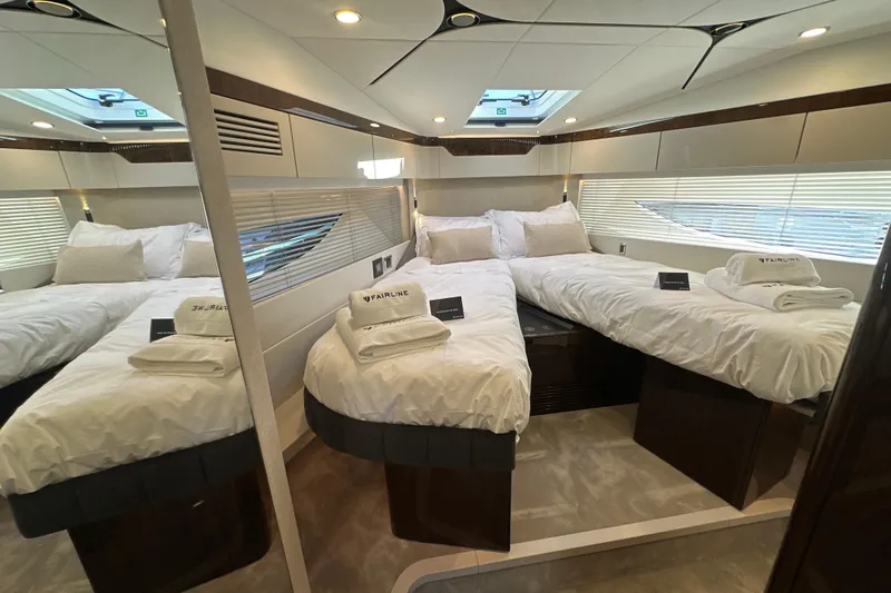 Slide: The Image of Luxurious cabin interior of 2026 Fairline Targa 47 GT yacht with twin beds. - 30