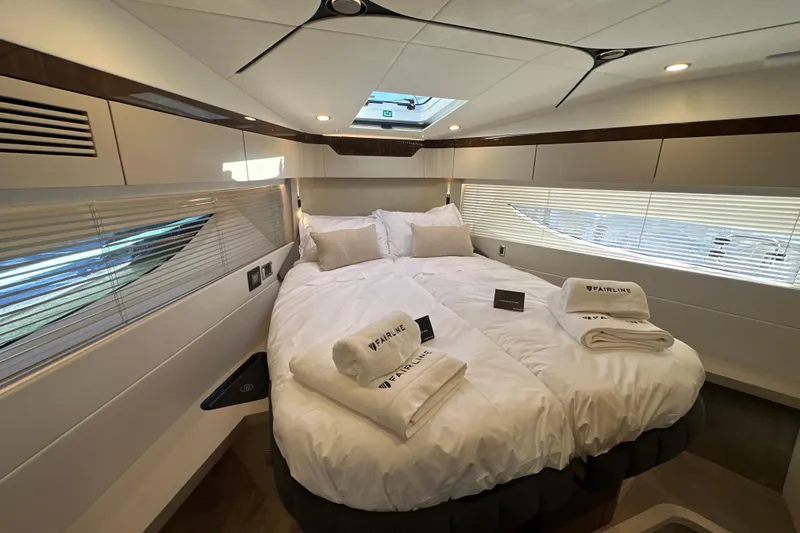 Slide: The Image of Luxurious cabin interior of 2026 Fairline Targa 47 GT yacht with plush bedding. - 31