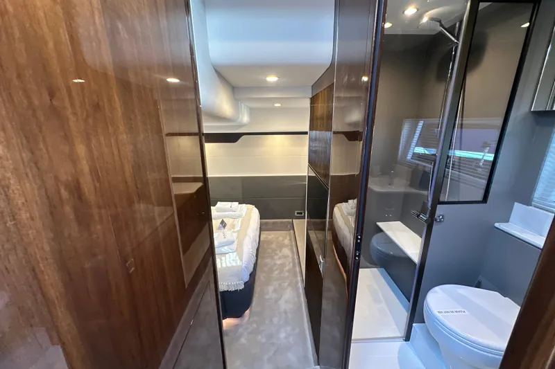 Slide: The Image of Luxurious interior of 2026 Fairline Targa 47 GT yacht, featuring modern bathroom and cozy bedroom. - 36