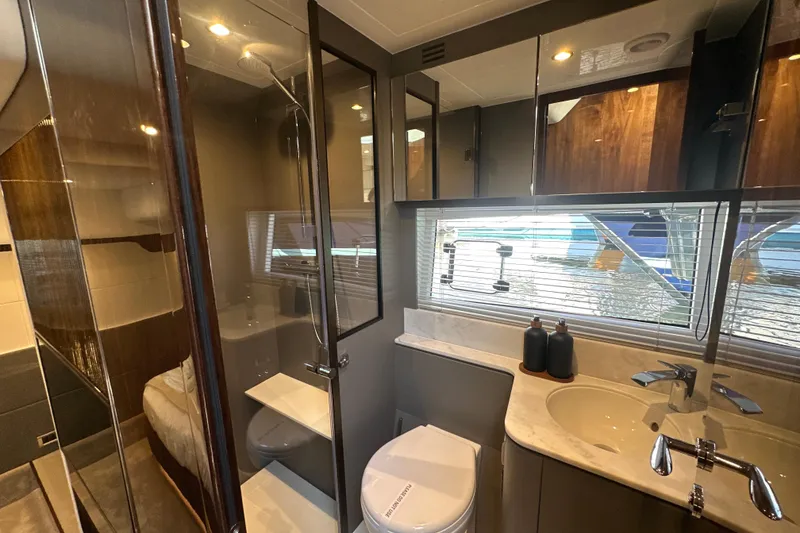 Slide: The Image of Luxurious bathroom interior of 2026 Fairline Targa 47 GT yacht, featuring modern fixtures and elegant design. - 37