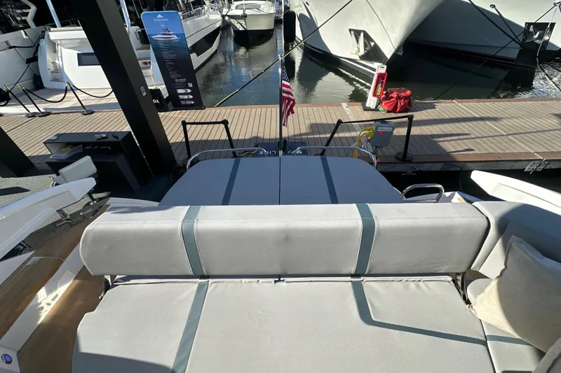 Slide: The Image of Luxury Fairline Targa 47 GT yacht interior, showcasing elegant seating and dockside view. - 49