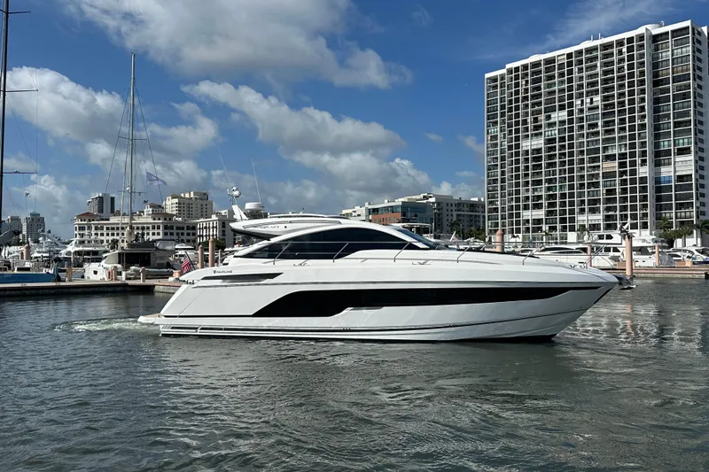 Slide: The Image of 2026 Fairline Targa 47 GT yacht docked in a marina, cityscape background. - 5