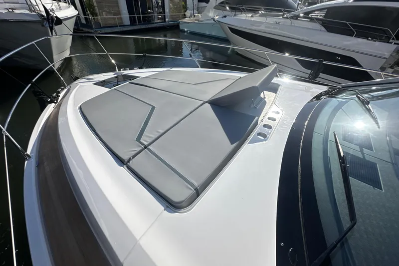 Slide: The Image of 2026 Fairline Targa 47 GT yacht with sleek deck design and sunbathing area. - 54