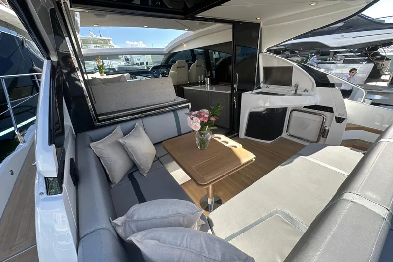 Slide: The Image of Luxurious interior of 2026 Fairline Targa 47 GT yacht with elegant seating and table. - 58